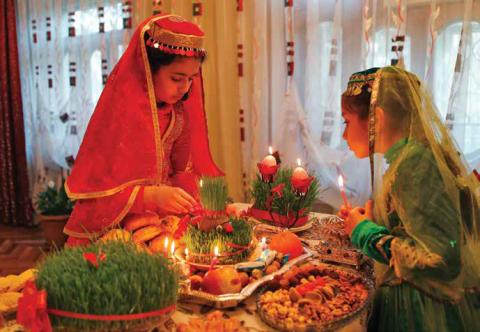 Girls decorate table for Novruz